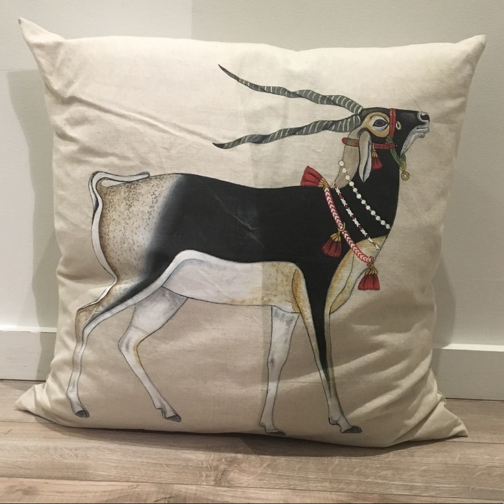 A decorative pillow with a dress up Blackbuck